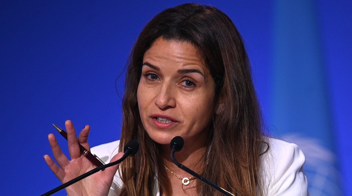  A woman speaking from a podium 