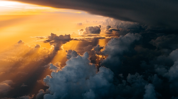 Photo of sunlight through clouds